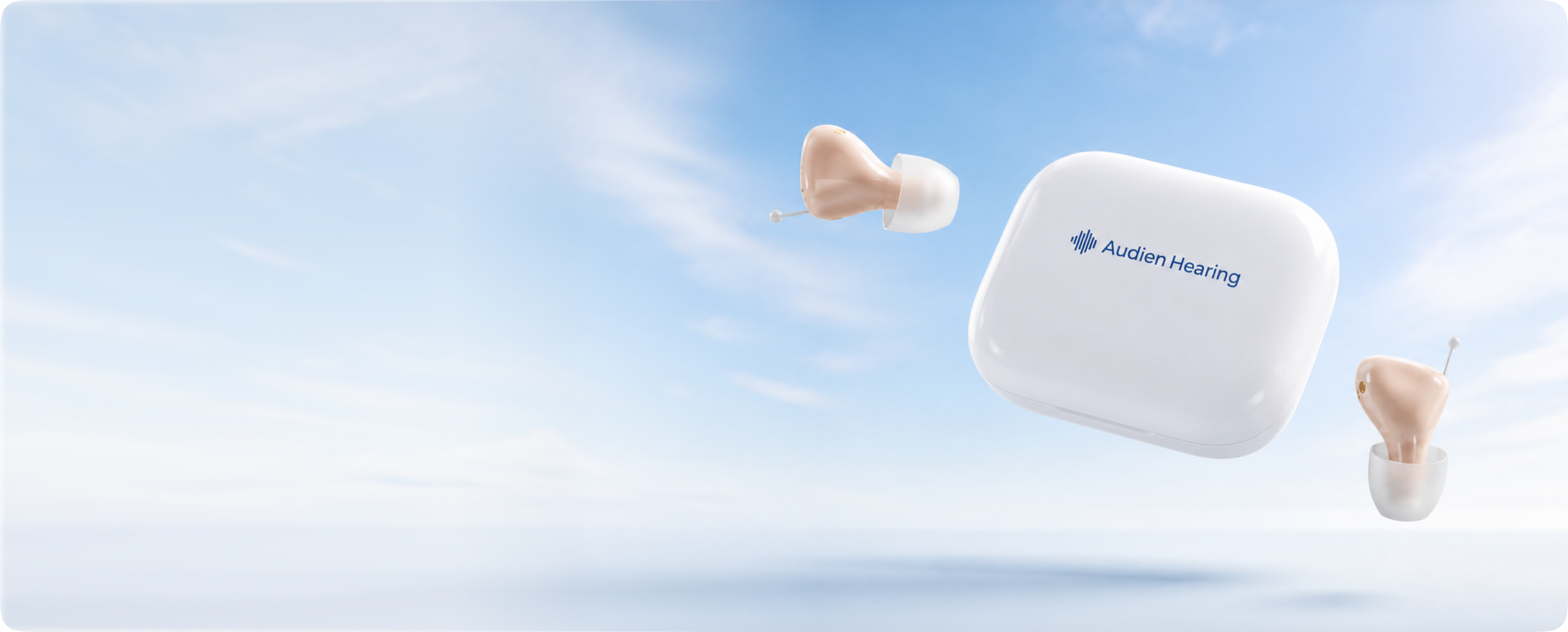 two hearing aids floating against a blue sky with atom air hearing device 